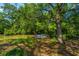 This backyard features a dock with a water view, as well as numerous trees at 734 Waterloo St, Charleston, SC 29412