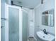 This bathroom features a shower with sliding doors, a sink, and a mirror with a black frame at 734 Waterloo St, Charleston, SC 29412