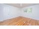 Cozy bedroom with natural light, gleaming wood floors, and fresh white walls at 734 Waterloo St, Charleston, SC 29412