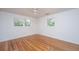 Inviting bedroom featuring hardwood floors, a ceiling fan, and natural light at 734 Waterloo St, Charleston, SC 29412