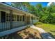 Charming front porch with decorative iron railings and a well-manicured lawn, adding curb appeal to this inviting home at 734 Waterloo St, Charleston, SC 29412