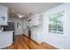 Bright kitchen with white cabinets, stainless appliances, and wood floors at 734 Waterloo St, Charleston, SC 29412