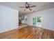 Open living room features hardwood floors and sliding door to backyard at 734 Waterloo St, Charleston, SC 29412