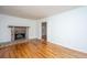 Spacious living room with fireplace, hardwood floors, and view to side room at 734 Waterloo St, Charleston, SC 29412