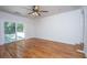 Spacious living room with hardwood flooring and access to the backyard through sliding glass doors at 734 Waterloo St, Charleston, SC 29412