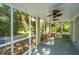 Spacious screened porch with ceiling fans, offering a peaceful outdoor living space at 734 Waterloo St, Charleston, SC 29412