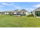 View of a beautifully landscaped backyard with patio and seating area, perfect for outdoor entertaining at 753 Blue Iris Way, Summerville, SC 29486