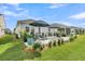Expansive backyard with green lawn, manicured landscaping, and patio for outdoor enjoyment and entertainment at 753 Blue Iris Way, Summerville, SC 29486