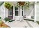 Welcoming front porch featuring a bench and hanging plants at 753 Blue Iris Way, Summerville, SC 29486