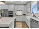 Well-equipped kitchen featuring white cabinets and stainless-steel appliances at 753 Blue Iris Way, Summerville, SC 29486