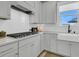 Modern kitchen with a farmhouse sink and ample counter space at 753 Blue Iris Way, Summerville, SC 29486