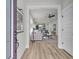Open-concept living room featuring light hardwood floors and modern furniture at 753 Blue Iris Way, Summerville, SC 29486