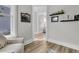 Bright living room with hardwood flooring and a view to the hallway at 753 Blue Iris Way, Summerville, SC 29486