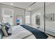 Elegant main bedroom with a view into the ensuite bath and shower, enhanced with natural light at 753 Blue Iris Way, Summerville, SC 29486