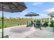 Outdoor seating area offers relaxing space with views of the community green space at 753 Blue Iris Way, Summerville, SC 29486
