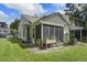 Charming screened-in back porch, perfect for outdoor relaxation and entertaining at 8059 Shadow Oak Dr, North Charleston, SC 29406