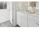 Bright bathroom featuring a double sink vanity with white cabinets and countertop at 8712 Silver Perch Ln, North Charleston, SC 29420