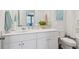Bright, clean bathroom with white vanity, toilet, and shower/bath combo at 8712 Silver Perch Ln, North Charleston, SC 29420