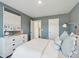 Bedroom featuring a white dresser, contemporary decor, and modern lighting at 8712 Silver Perch Ln, North Charleston, SC 29420