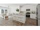 Open-concept kitchen flows into the living area, filled with natural light at 8712 Silver Perch Ln, North Charleston, SC 29420