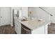 A well-appointed kitchen island with granite countertop and modern fixtures, with seating at 8712 Silver Perch Ln, North Charleston, SC 29420