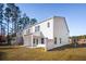A spacious backyard with a covered patio, perfect for outdoor entertaining and relaxation at 8746 Silver Perch Ln, North Charleston, SC 29420