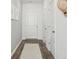Clean entryway featuring light gray walls, white trim, and a stylish neutral rug at 8746 Silver Perch Ln, North Charleston, SC 29420