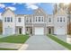Charming townhomes feature a modern design, attached garages, and well-manicured lawns at 8746 Silver Perch Ln, North Charleston, SC 29420