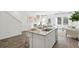 Modern open kitchen with a granite island, stainless appliances, and seamless flow at 8746 Silver Perch Ln, North Charleston, SC 29420