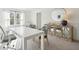 Well-lit office with a large desk, modern decor, and ample workspace at 8746 Silver Perch Ln, North Charleston, SC 29420