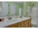 Bright bathroom featuring a double sink vanity with modern fixtures and a shower-tub combo at 9024 Parlor Dr, Ladson, SC 29456