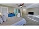 Spacious bedroom with a large seating area, multiple doors and windows and ensuite bathroom at 9024 Parlor Dr, Ladson, SC 29456