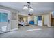 Spacious bedroom with a large seating area, multiple doors and windows and ensuite bathroom at 9024 Parlor Dr, Ladson, SC 29456