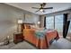 Nicely decorated bedroom featuring carpet floors, a ceiling fan and neutral decor at 9024 Parlor Dr, Ladson, SC 29456