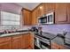 Modern kitchen with stainless steel appliances, granite countertops, and ample cabinet space for convenient cooking at 9024 Parlor Dr, Ladson, SC 29456