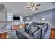 Comfortable living room featuring hardwood floors, neutral walls, and a large sectional for relaxation at 9024 Parlor Dr, Ladson, SC 29456
