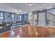 Spacious living area with hardwood floors, built-in shelving, and a cozy sectional sofa for comfortable living at 9024 Parlor Dr, Ladson, SC 29456