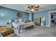Comfortable main bedroom with carpet floors, modern ceiling fan, and coastal inspired decor at 9024 Parlor Dr, Ladson, SC 29456