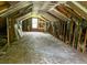 Unfinished attic space with exposed beams and wooden floors at 93 Knights Ave, Walterboro, SC 29488