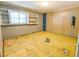 View of a room with a window, shelving, and unfinished flooring at 93 Knights Ave, Walterboro, SC 29488