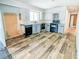 Kitchen with wood-look floors, gray cabinets, and a window at 93 Knights Ave, Walterboro, SC 29488