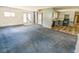 Open living room leading to a kitchen, with windows and natural light at 93 Knights Ave, Walterboro, SC 29488