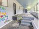 Image of a homes partially covered patio with writing on the floor and walls at 93 Knights Ave, Walterboro, SC 29488