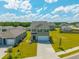 An attractive two-story home with a two-car garage nestled in a well-maintained community, aerial view at 1032 Peridote Way, Ladson, SC 29456