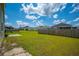 Large backyard with a patio area and green grass, fenced for privacy and security at 1032 Peridote Way, Ladson, SC 29456