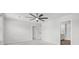 Bright bedroom featuring neutral carpet, ceiling fan and several doors to other rooms at 1032 Peridote Way, Ladson, SC 29456