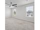 Spacious bedroom with two large windows offering ample natural light and view to adjacent home at 1032 Peridote Way, Ladson, SC 29456