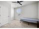 Bright bedroom featuring a ceiling fan, neutral carpet, and a window with pleasant outdoor views at 1032 Peridote Way, Ladson, SC 29456