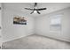 Bedroom with carpeted floors, a ceiling fan, and an oversized window at 1032 Peridote Way, Ladson, SC 29456