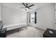Simple bedroom with neutral carpet, ceiling fan, and a window with natural light at 1032 Peridote Way, Ladson, SC 29456